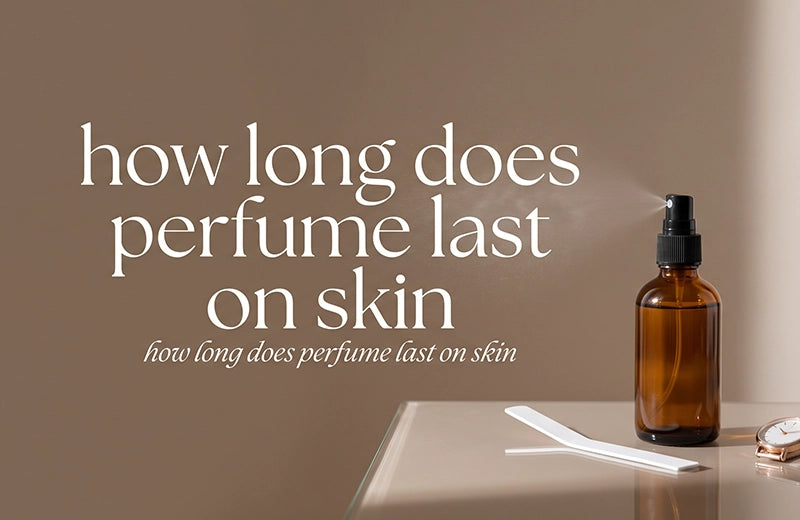 Amber glass perfume spray bottle releasing a fine mist beside a scent strip and a wristwatch